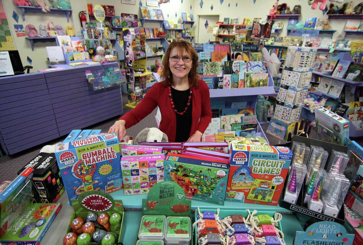 Linda Devlin, who owns Linda's Story Time Bookstore, poses at the store in Monroe, Conn., on Tuesday Jan. 29, 2019. Devlin is retiring this summer, and recently announced that store will soon have a new name and a new owner.