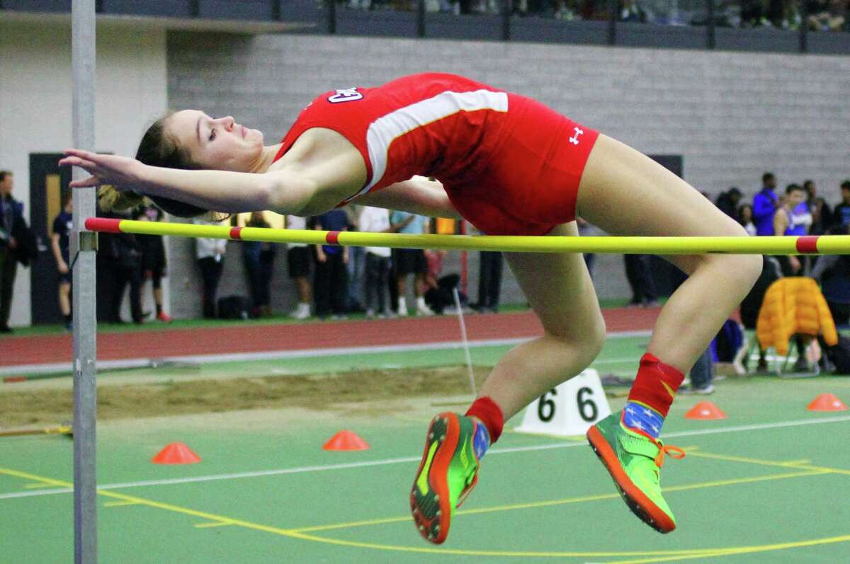Greenwich’s Stella Perrier competes in the high jump during the FCIAC Track Championships Thursday in New Haven.