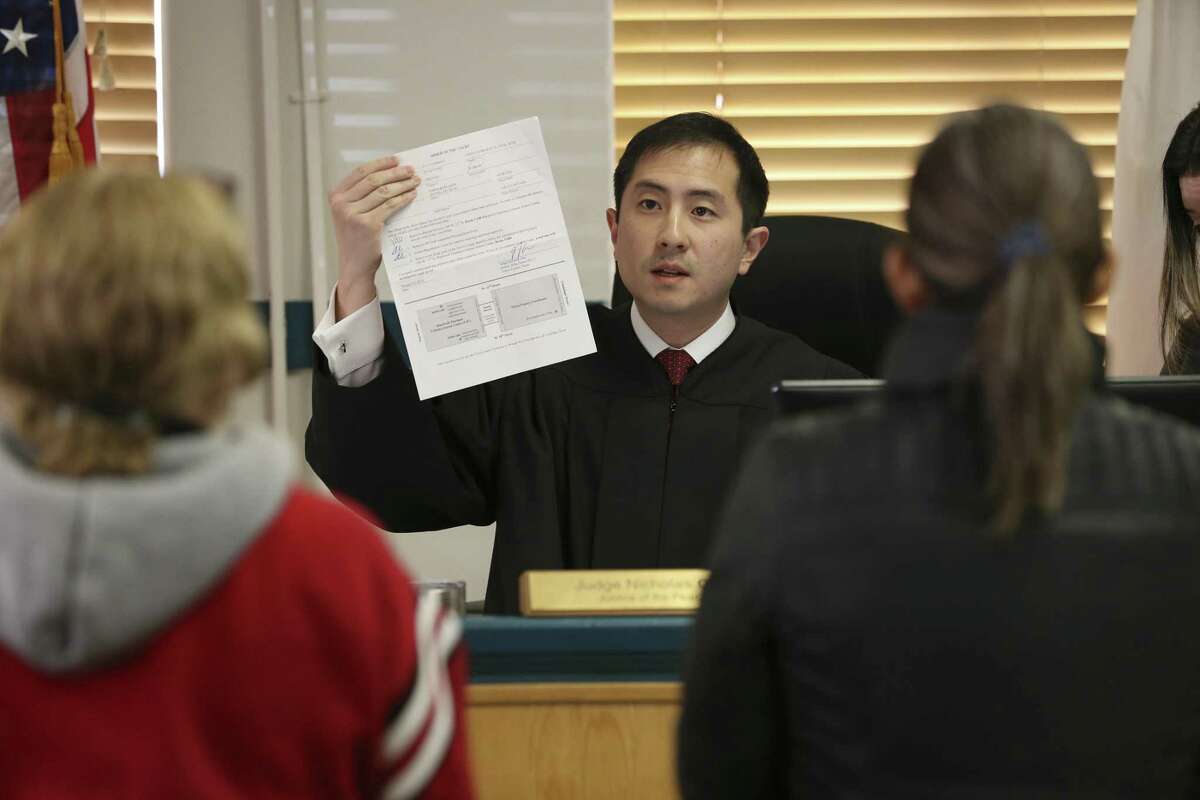 Travis County Justice of the Peace Precinct 5 Judge Nicholas Chu talks with people accused of low-level misdemeanors during a court hearing in Austin on Jan. 24, 2019. Sometimes, defendants are confused about the program known as cite and release, and Chu sometimes has to explain they that can’t just pay a fine and have their charge dismissed.