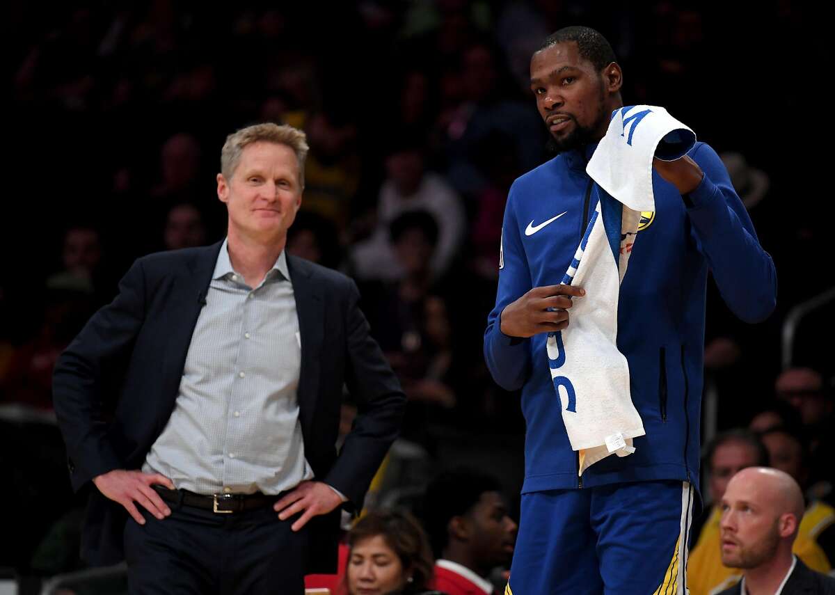 LOS ANGELES, CALIFORNIA - JANUARY 21: Kevin Durant #35 and Steve Kerr of the Golden State Warriors smile courtside during a 130-111 win over the Los Angeles Lakers at Staples Center on January 21, 2019 in Los Angeles, California. NOTE TO USER: User expressly acknowledges and agrees that, by downloading and or using this photograph, User is consenting to the terms and conditions of the Getty Images License Agreement. (Photo by Harry How/Getty Images)