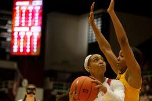 Stanford guard DiJonai Carrington (21) drives to the basket against California center Kristine Anigwe (31) during the second quarter of an NCAA women's basketball game on Saturday, Feb. 2, 2019 in Stanford, Calif.