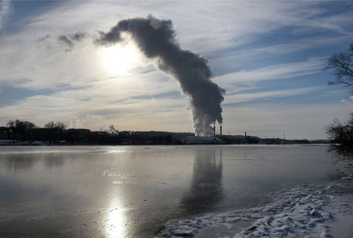 Steam and emissions rise from the Rensselaer Cogeneration power plant on Friday, Feb. 1, 2019, viewed from Albany, N.Y. (Will Waldron/Times Union)