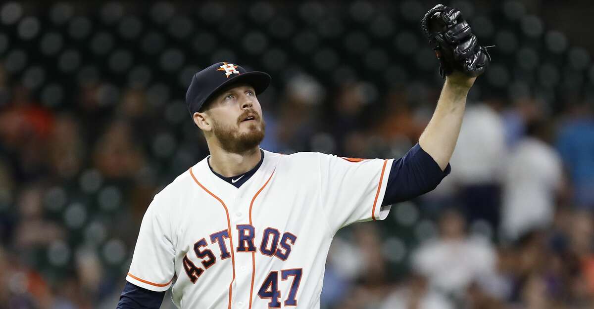 Houston Astros relief pitcher Chris Devenski (47) between pitches during the eighth inning of an MLB baseball game at Minute Maid Park, Thursday, August 30, 2018, in Houston.