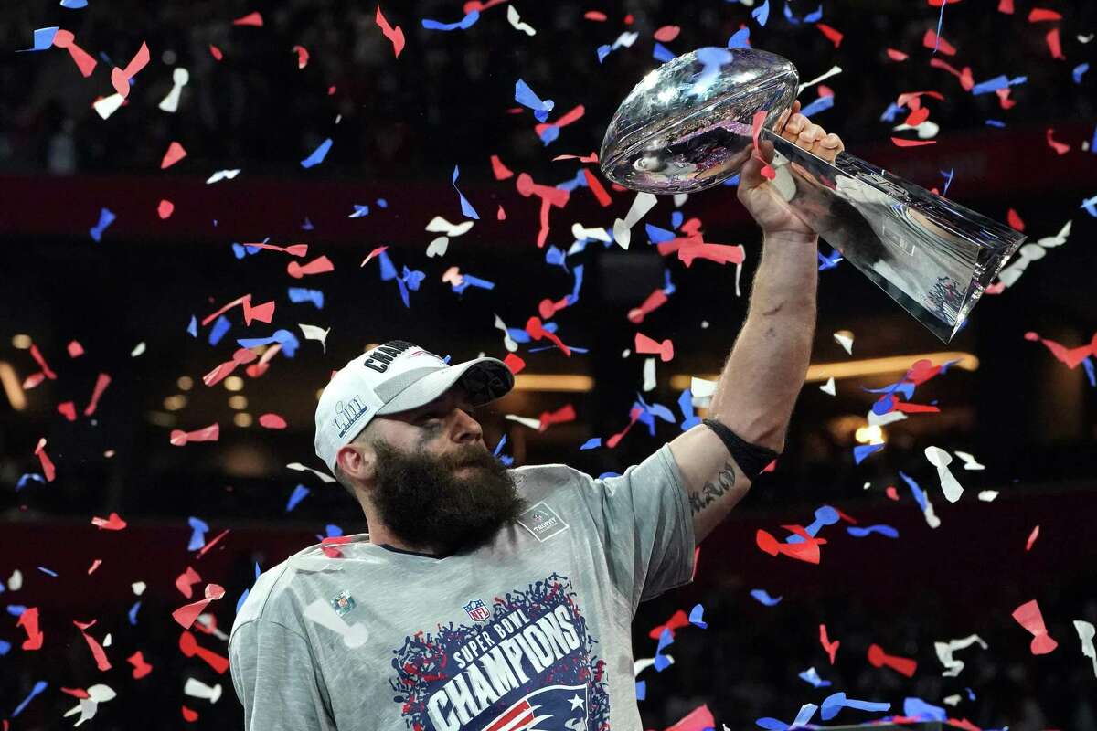 New England receiver Julian Edelman, the game’s MVP, shows off the Vince Lombardi Trophy that went to the Patriots for a record-tying sixth time.