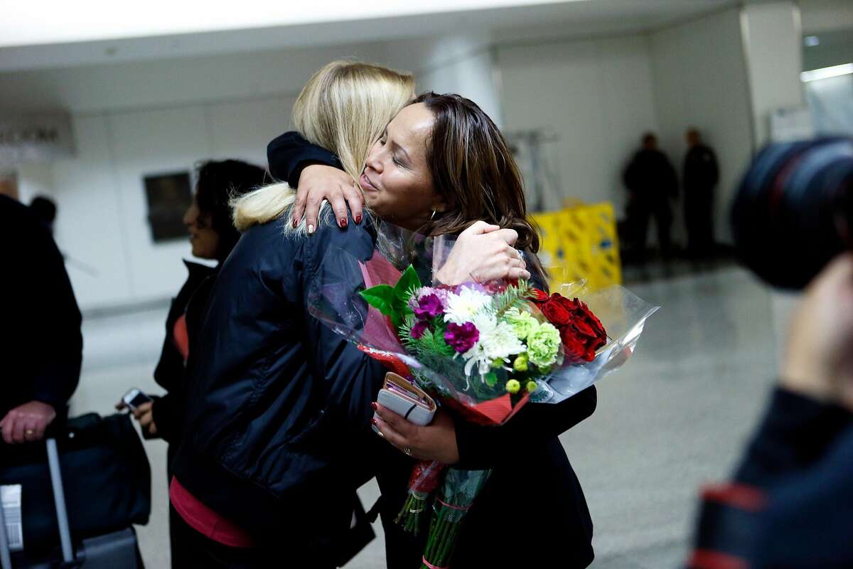 Maria Mendoza-Sanchez is greeted by friends and family at SFO on Saturday, Dec. 15, 2018, in San Francisco, Calif. Mendoza-Sanchez, a nurse who was separated from her children and deported to Mexico last year after more than two decades in Oakland, won her improbable fight to return to the United States. Her visa was approved by U.S. Citizenship and Immigration Services.