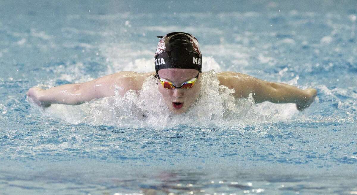 Kailey Turner of Magnolia competes in the girls 100-yard butterfly during the District 21-5A Swimming & Diving Championships at the Tomball ISD Aquatic Center, Saturday, Jan. 26, 2019, in Tomball.