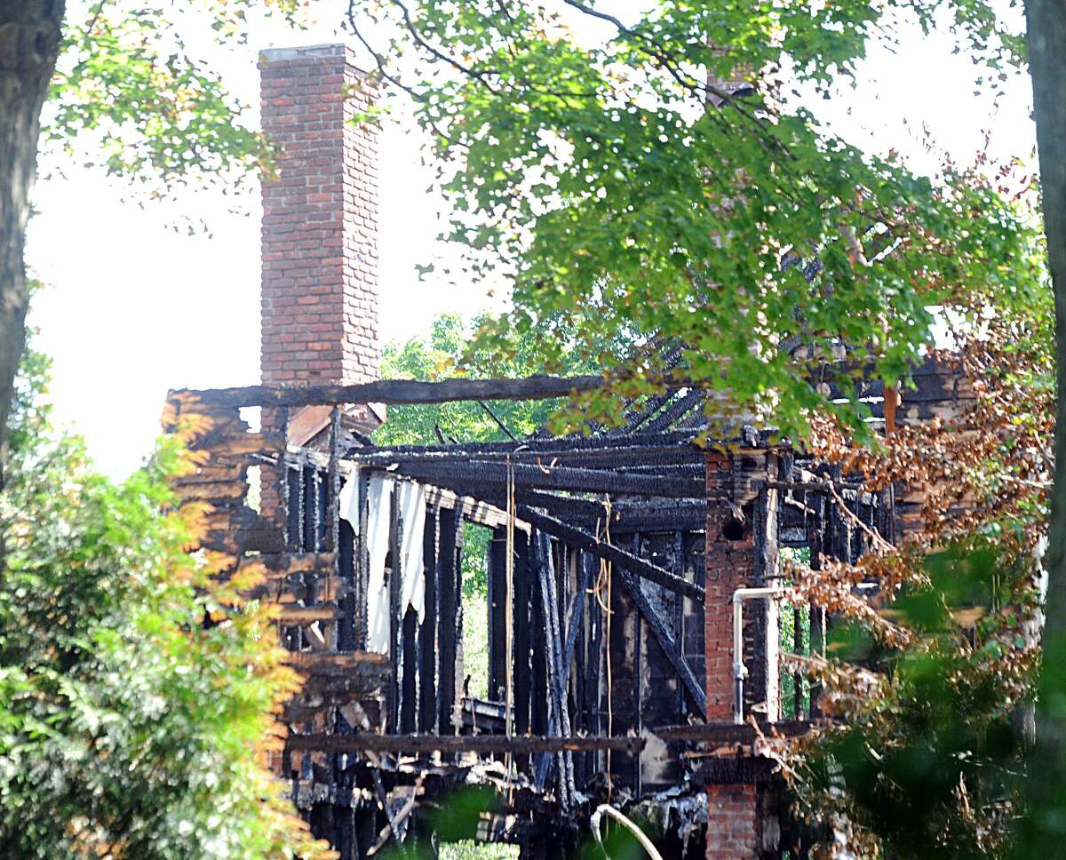 The aftermath of a house fire that occurred Friday, August 10, at 15 Locust Road in Greenwich, Conn., as seen Wednesday, August 15, 2018. The town is considering the start of work to add another fire station in the next municipal budget.