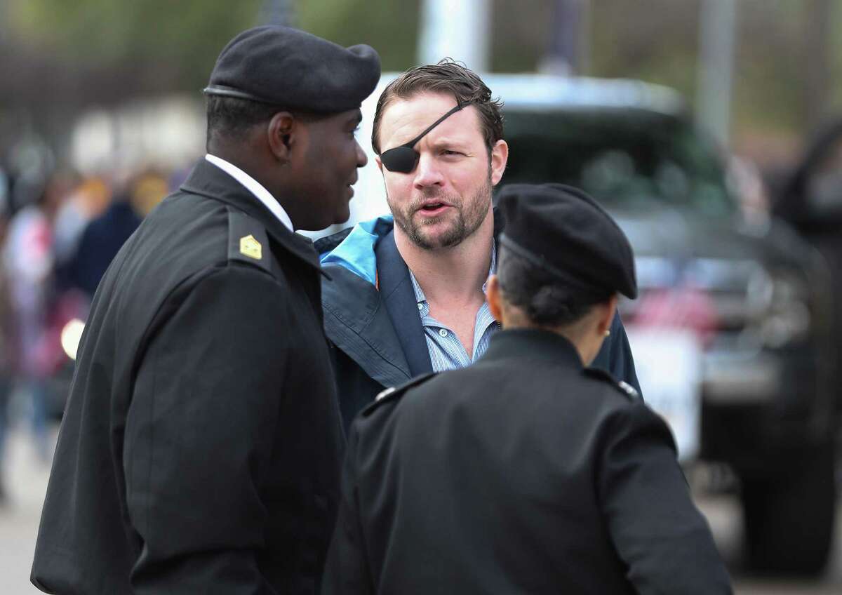 U.S. Representative for Texas's 2nd congressional district Dan Crenshaw talks to ROTC leaders before the 13th Annual MLK Youth Parade Saturday, Jan. 19, 2019, in Houston.