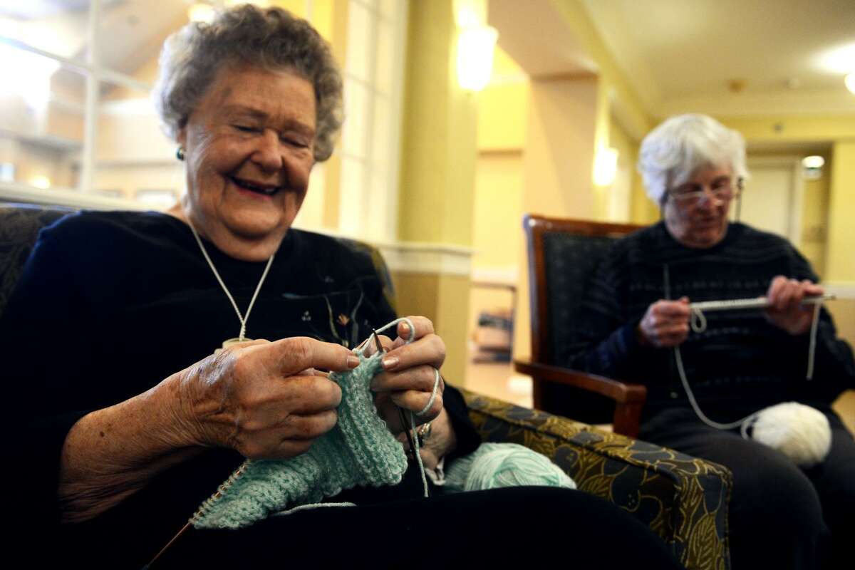 Birdie Bezursik, left, knits at hat during the “Little Hats, Big Hearts” event at Middlebrook Farms, in Trumbull, Conn. Jan. 21, 2019. Residents of the facility gathered together to knit hats for babies born with life threatening congenital heart defects. Their goal is to make 100 hats, over the next month, that will be donated to local hospitals.
