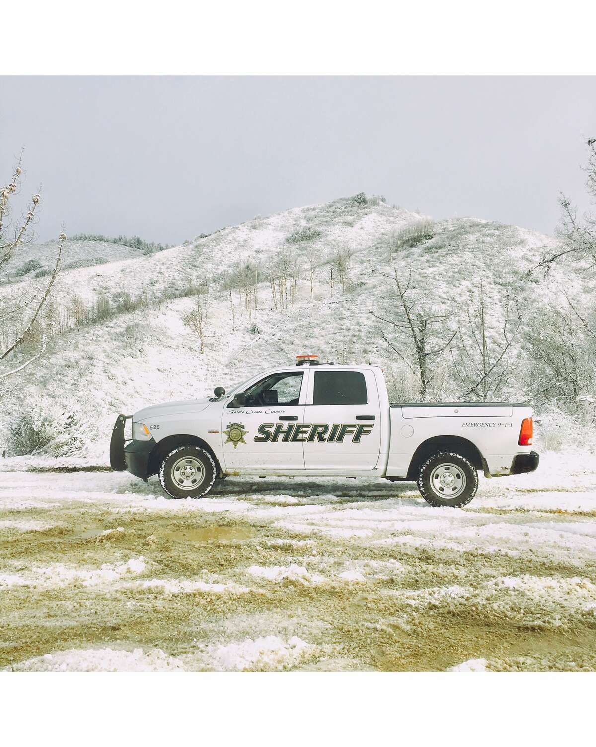 Santa Clara County Sheriff vehicles helped a standed motoris on Loma Prieta Road. Snow fell across the Bay Area on Feb. 5, 2019.