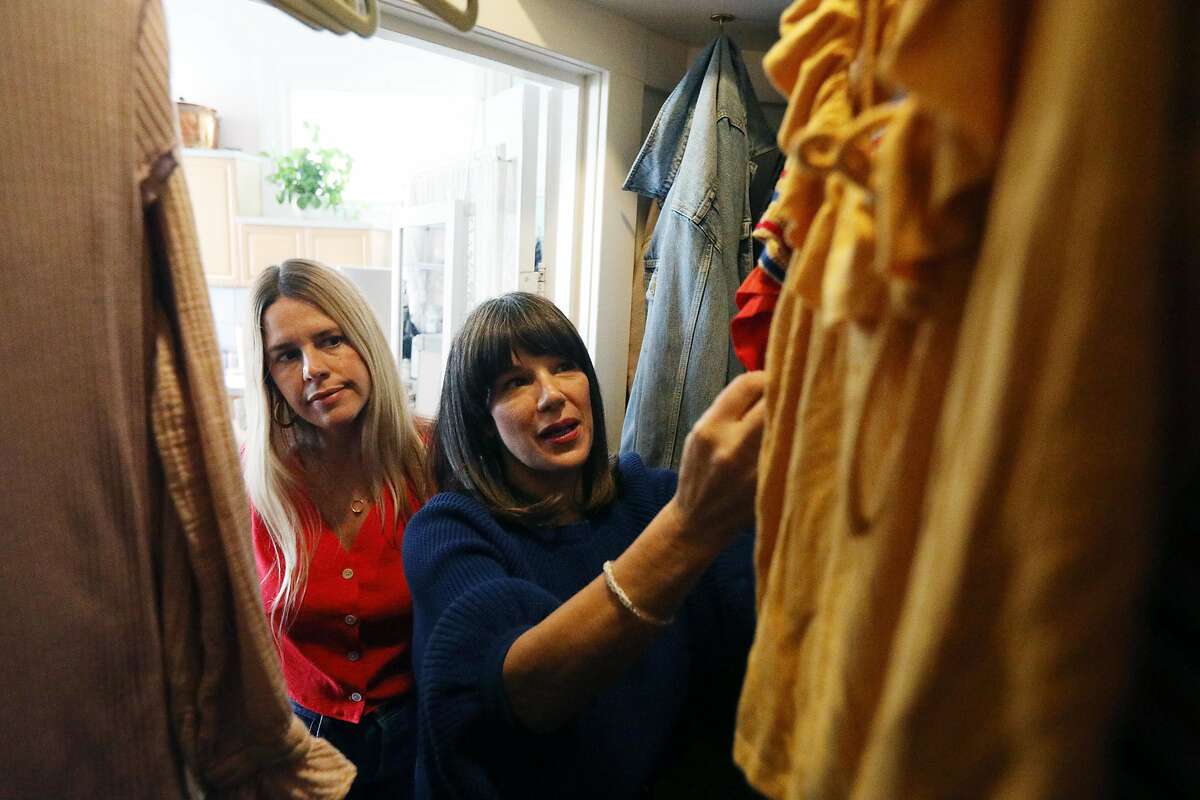 Mira Pickett (right), owner Mira Mira The Edit, and client Joanna Riedl (left) discuss items in Riedl's closet during a a closet and style consultation on Monday, February 4, 2019 in San Francisco, Calif.