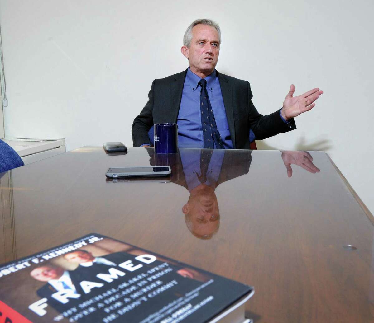 Robert Kennedy Jr., speaks about his book, "Framed: Why Michael Skakel Spent Over a Decade in Prison for a Murder He Didn’t Commit," during an interview at the Greenwich Time in Greenwich, Conn., Saturday, July 16, 2016. Kennedy, a former prosecutor, is a cousin of Michael Skakel, the subject of his book, who in 2002 was convicted of murder in the 1975 killing of Martha Moxley, 15, in Greenwich. Three years ago a Connecticut judge threw out Skakel's murder conviction on the grounds that Skakel did not receive a fair trial due to an inept defense. Skakel is free on bond awaiting the outcome of a Connecticut Supreme Court decision regarding his thrown-out murder conviction.