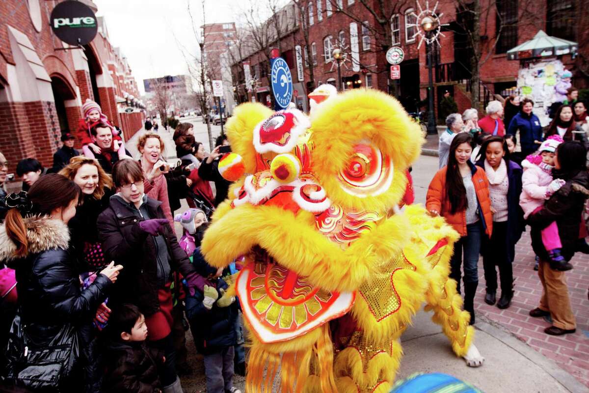 The Lion Dance draws smiles on Audubon Street in New Haven.
