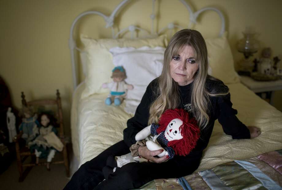 Gwen Casados sits in her daughter's room in Houston. Her daughter, Heather Schneider, was sexually abused inside Second Baptist Church in Houston in 1994 and later died of a drug overdose. Photo: Jon Shapley/Staff Photographer