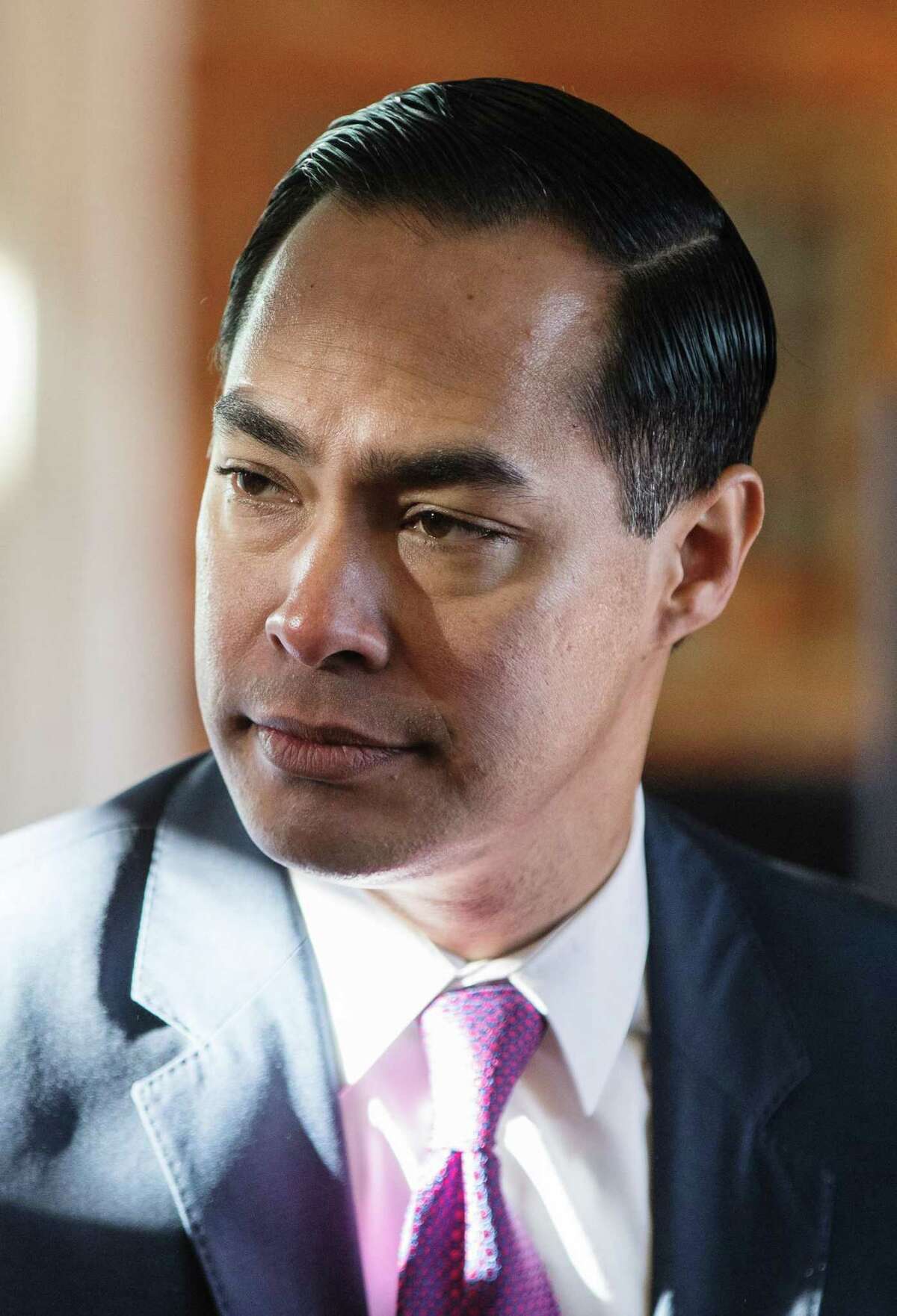 Julian Castro, former secretary of Housing and Urban Development (HUD), listens as a volunteer speaks at the "Navigating Recovery of the Lakes Region" organization in Laconia, New Hampshire, U.S., on Wednesday, Jan. 16, 2019. With the potential for the biggest field of Democratic candidates in a generation looking to challenge President Donald Trump in 2020, some would-be campaign staffers are playing hard to get with less prominent candidates trying to get an early jump in Iowa and other early nominating states. Photographer: Scott Eisen/Bloomberg