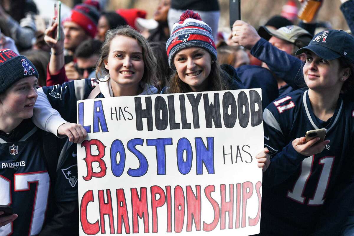 BOSTON, MASSACHUSETTS - FEBRUARY 05: Fans display signs during the Super Bowl Victory Parade on February 05, 2019 in Boston, Massachusetts. (Photo by Billie Weiss/Getty Images)