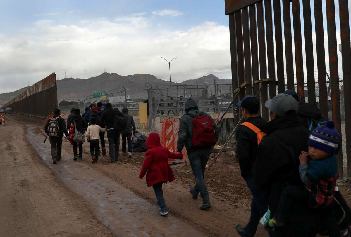 Photos: Central American asylum-seekers cross Rio Grande to El Paso border