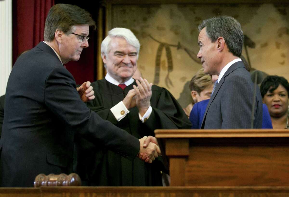 Speaker of the House Joe Straus, right, is congratulated by Lt. Gov.-elect Dan Patrick, left, and Texas Supreme Court Chief Justice Nathan Hecht, middle, before being sworn in as Speaker on the first day of the 84th legislative session at the Capitol in Austin, Tx., on Tuesday January 13, 2015. (AP PHOTO/Jay Janner Austin American-Statesman)