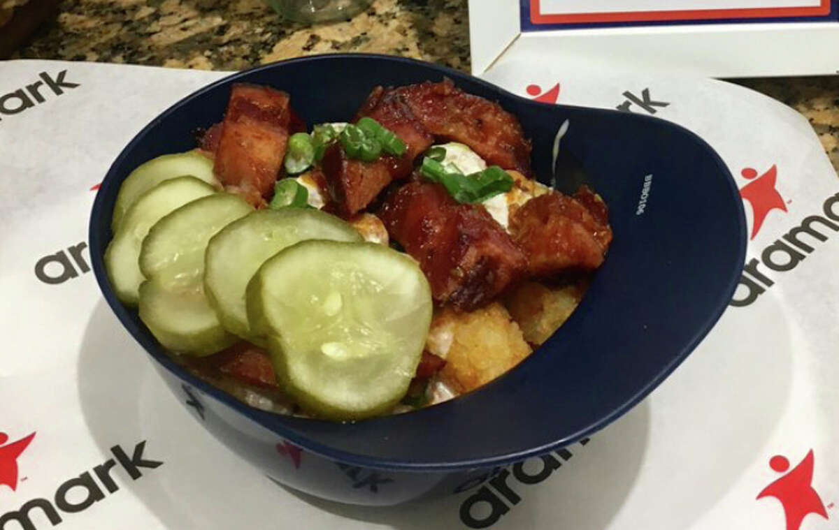 Pork Burnt Ends Totchos: Tater Tots, queso blanco, green onions, smoked pork burnt ends, barbecue sauce and pickle chips.