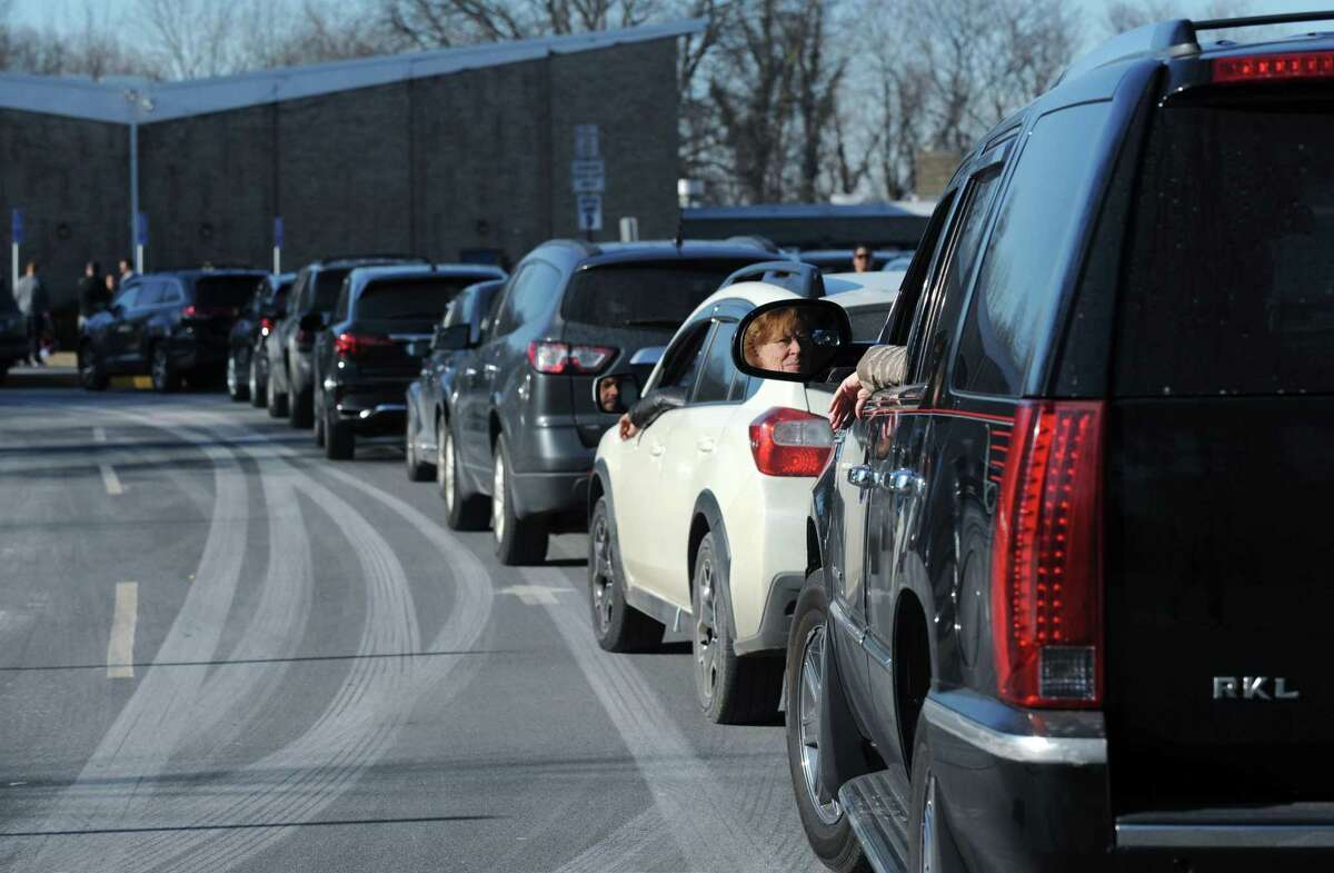 Students and parents make their way to their vehicles at the end of the school day at Naramake Elemenatry School Tuesday, February 5, 2019, in Norwalk, Conn. Parents are upset about the parking situation at Naramake because it becomes even more crowded when Norwalk High School parents come and pick up their kids at Naramake.