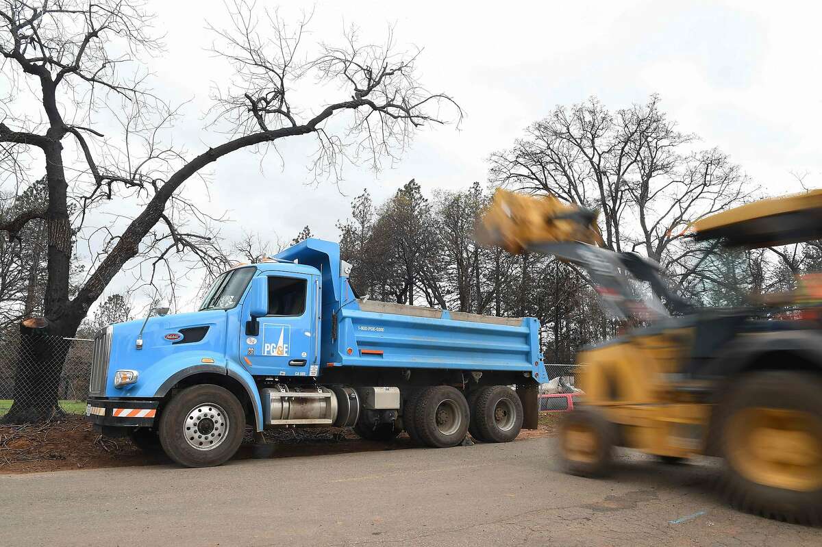 PG&E crews work to restore utility services in Paradise, California on February 01, 2019. - California utility PG&E, facing billions of dollars in potential liabilities over its role in a series of deadly wildfires, filed for bankruptcy protection January 29, 2019. (Photo by Josh Edelson / AFP)JOSH EDELSON/AFP/Getty Images