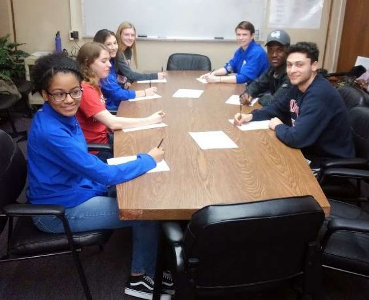 Danbury High honored seven athletes who are signed to collegiate programs on Wednesday.
