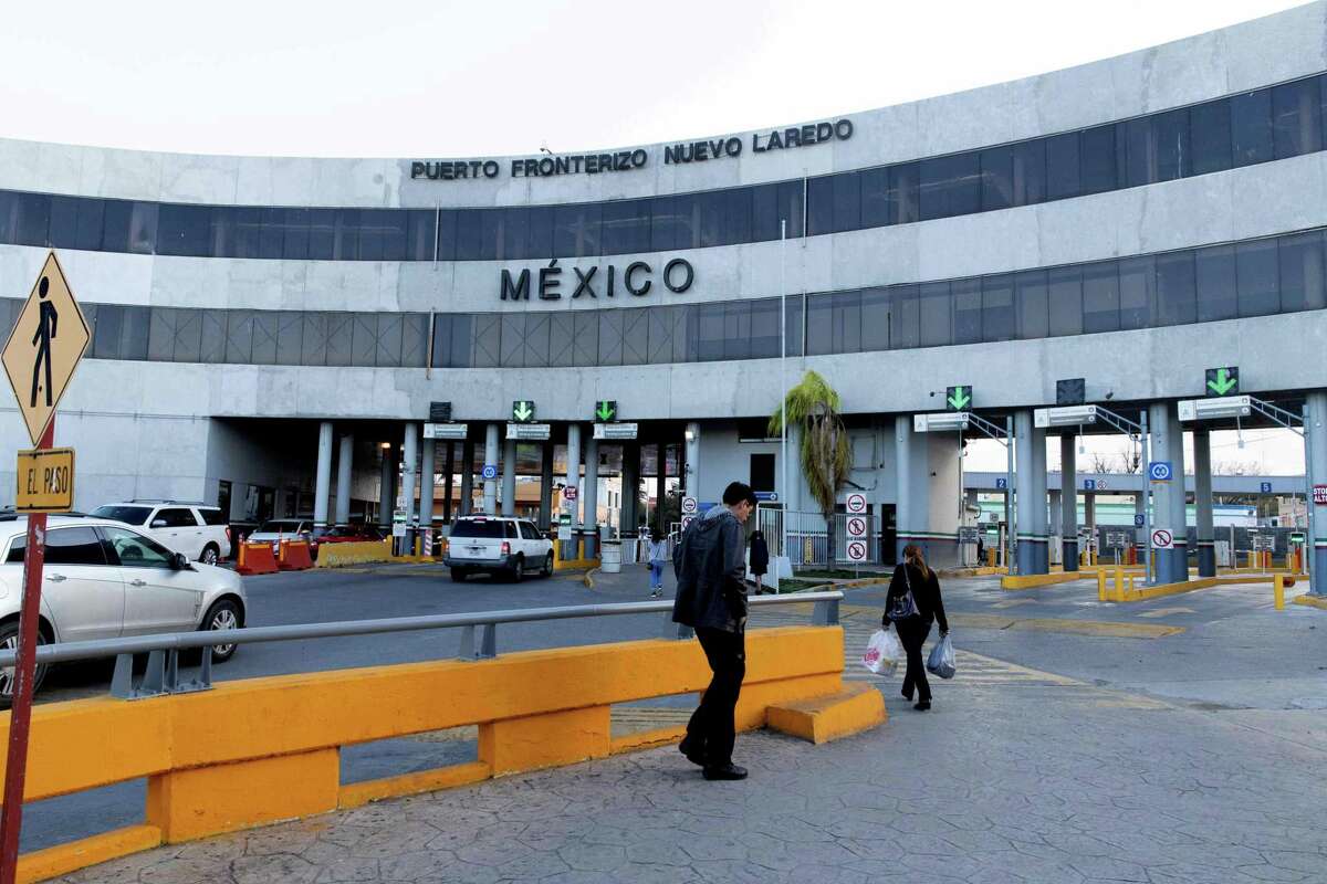 Vehicles and pedestrians enter Mexico from the US over the International Bridge into Nuevo Laredo in Laredo, Texas, on January 13, 2019.