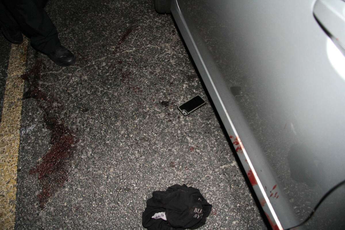 Graphic crime scene photos show aftermath of gun battle outside strip ...