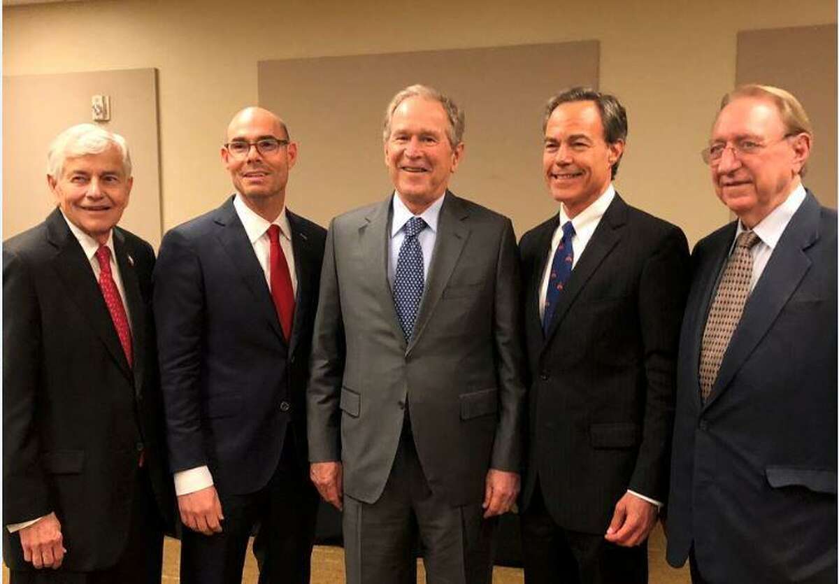 Former President George W. Bush poses for a rare photo with the last four Texas House speakers, politicians who have run the chamber over the last 26 years.