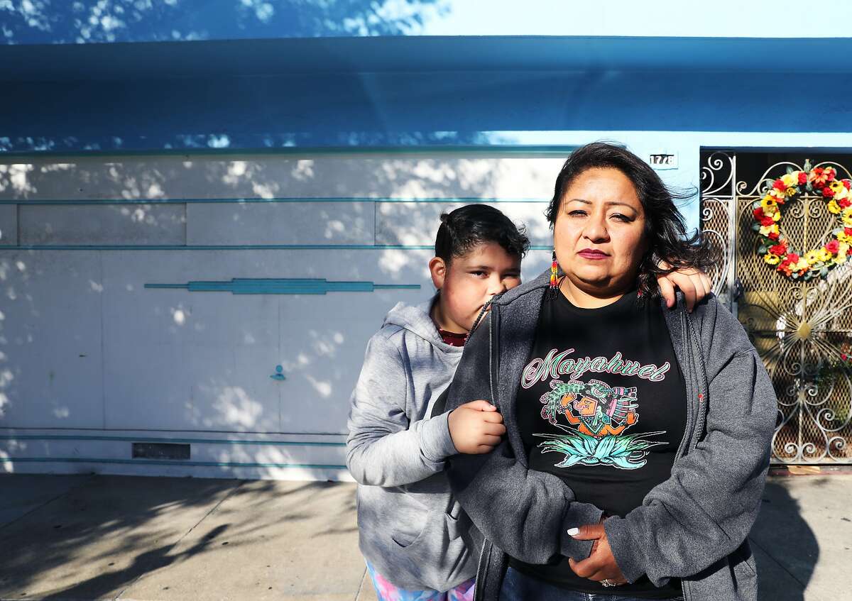Alyssa Tello, 10, and her mother, Reina Tello, 36, pose for a portrait in front of their former home at 1778 Newcomb Ave., in the Bayview District, in San Francisco, Calif., on Saturday, September 22, 2018. The Tellos were evicted from their home two days prior. "They came in and started yelling, 'Sheriff's department, sheriff's department,'" Alyssa recounted. "They didn't ring the doorbell. They didn't do many things they were supposed to do. They came in like they were ready for war." For the time being, the Tellos, which also includes Alyssa's sister, Marisol Tello, 6, maternal grandmother, Juana Ines Tello, 70, and aunt, Juana Tello, 32, are staying with a relative until they can find housing.