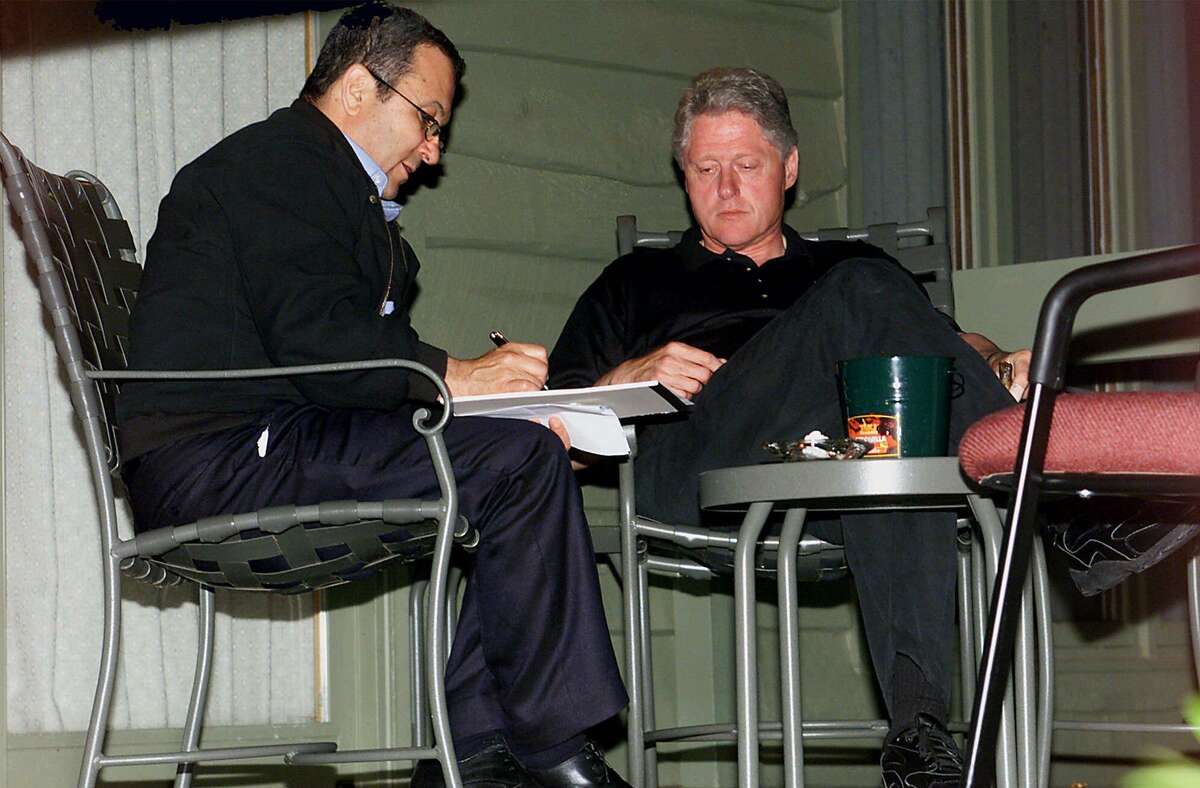 President Clinton and Israeli Prime Minister Ehud Barak confer July 18, 2000, at Camp David, Md.