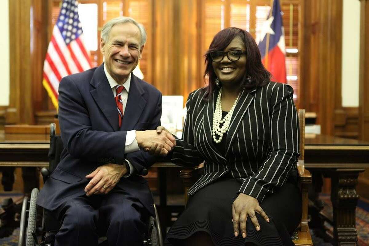 Gov. Greg Abbott (left) shakes hands with Tamala Austin, owner of JIVE Juice Company, recognizing her success at the 2019 State of the State Address on Thursday, Feb. 5. "Digging deeper, you'll see that we lead the nation in jobs created by African-American business owners and Hispanic women business owners," Abbott said.