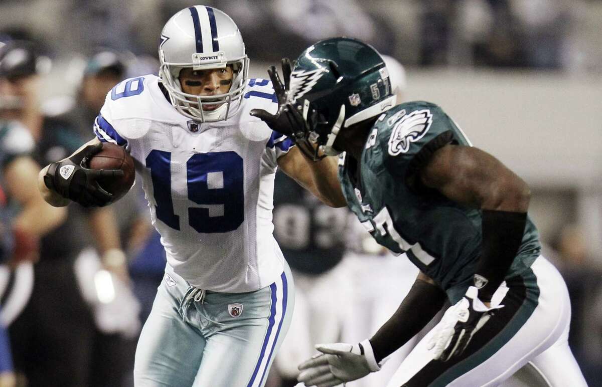 Wide receiver Miles Austin, left, after catching a pass against the Eagles in a December 2011 game. Austin is expected to join the 49ers’ staff as an offensive quality control coach.