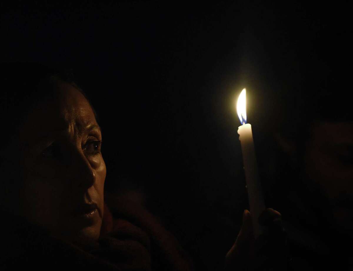 Friends and family grieve for homicide victim Valerie Reyes during a vigil in her honor at Glen Island Park in New Rochelle, N.Y. Thursday, Feb. 7, 2019. Reyes, 24, of New Rochelle, N.Y., was found bound inside of a suitcase just off of Glenville Road in a quiet, wooded area of Greenwich, Conn. on Tuesday morning.