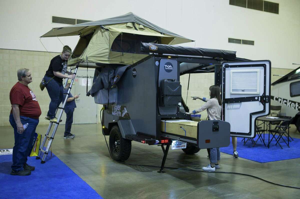 People check out a small trailer by TAXA Outdoors during the Houston RV Show at NRG Center, Wednesday, Feb. 6, 2019.