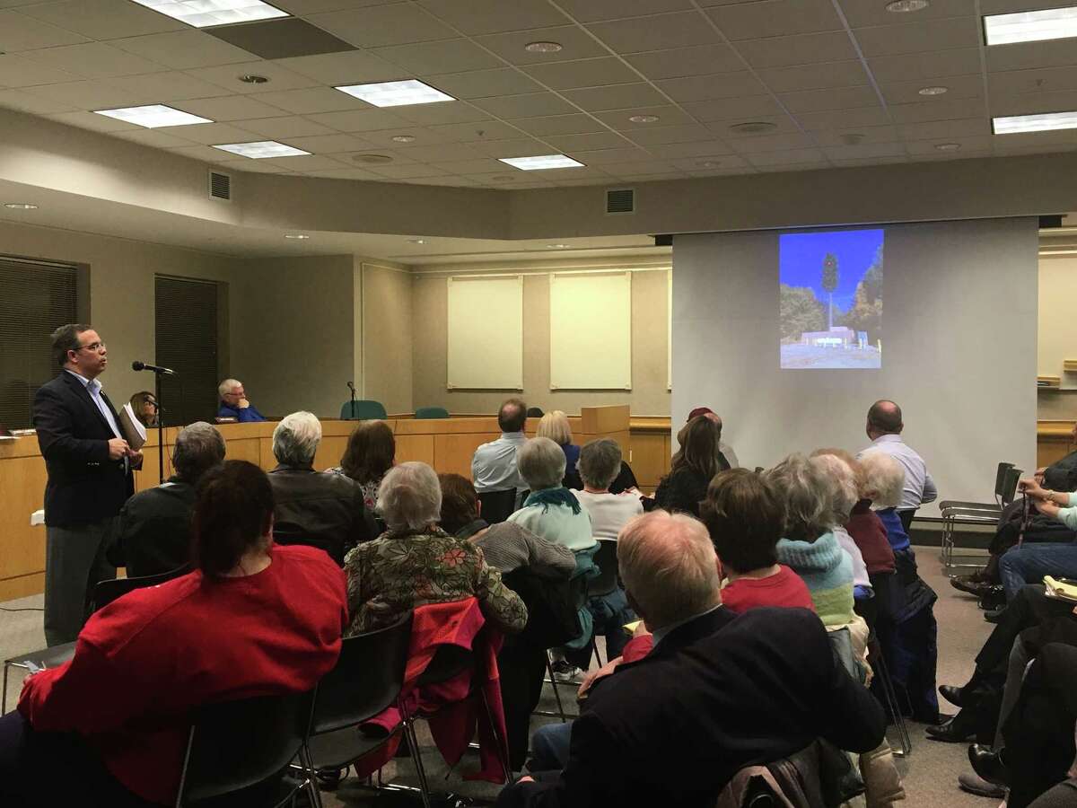 David Brennan, an attorney with Young/Sommer and local real estate counsel for Verizon, shows a crowd at the Colonie Zoning Board of Appeals what a proposed cell tower at 17 Elks Lane would look like on Thursday, Feb. 7, 2019.