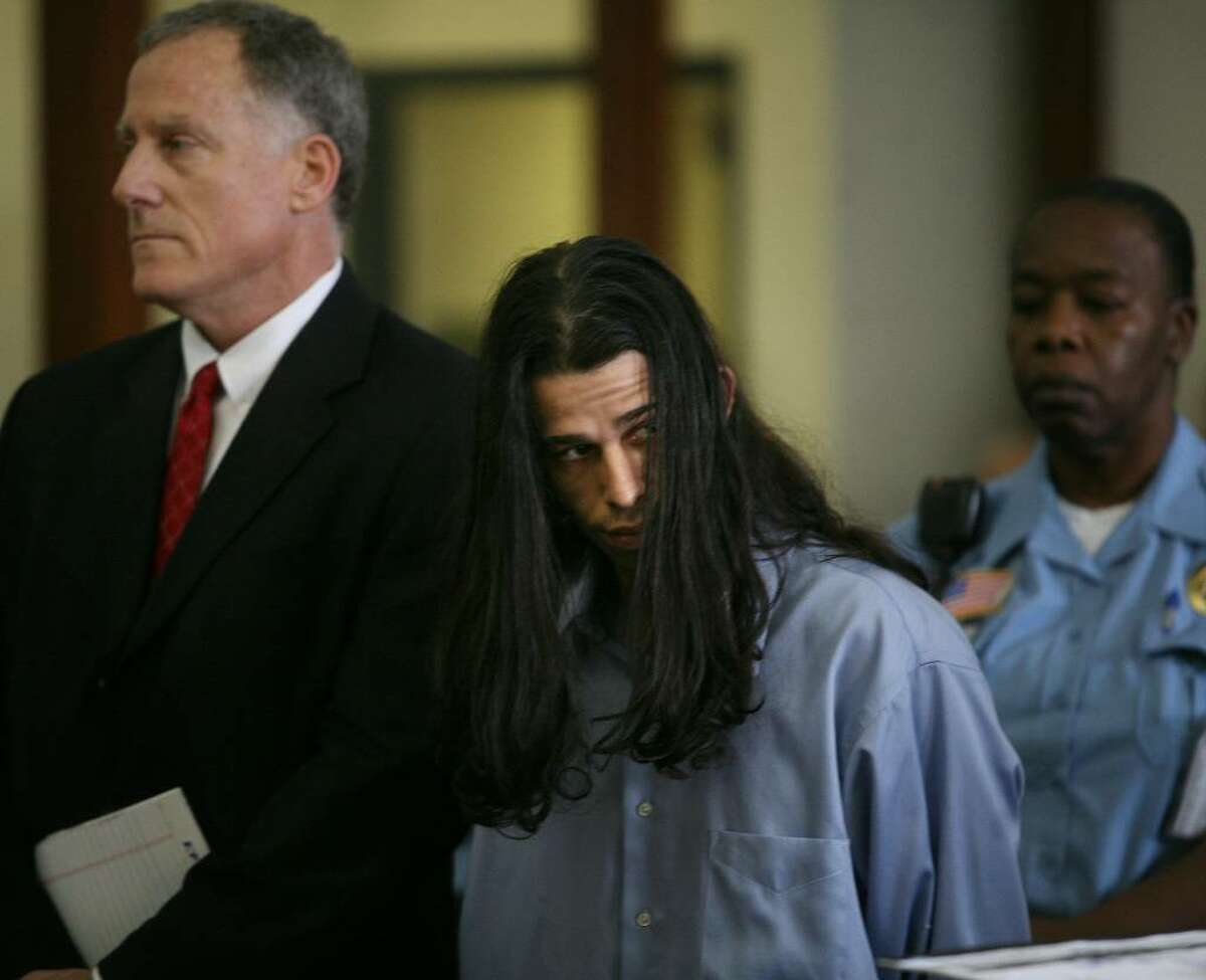 Standing alongside his lawyer, public defender Joseph Bruckmann, left, Rey Damien Garcia is arraigned on two counts of murder at the Fairfield County Courthouse on Golden Hill Street in Bridgeport, Tuesday, June 1, 2010.