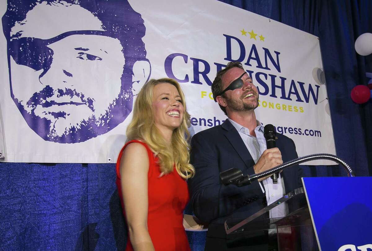 Republican congressional candidate Dan Crenshaw reacts to the crowd with his wife, Tara, as he comes on stage to deliver a victory speech during an election night party at the Cadillac Bar, Tuesday, May 22, 2018 in Houston. Crenshaw was in a run-off with Kevin Roberts for Texas congressional district 2. ( Mark Mulligan / Houston Chronicle )
