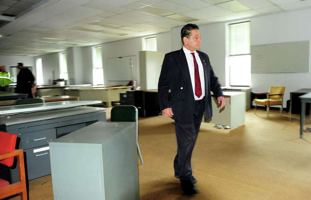 Ansonia Mayor David Cassetti walks through some of the former Farrel Corporation offices on Main Street. The building is being converted into the city’s new police headquarters.