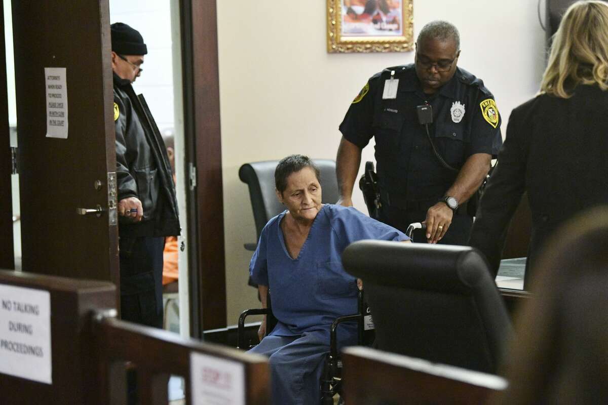 Beatrice Sampayo, 64, who is accused of helping cover up the death of her 8-month-old grandson, King Jay Davila, is wheeled through the courtroom during a bond hearing at which her bond was reduced from $250,000 to $50,000 by Judge Andrew Carruthers in Magistrate Court on Friday, Feb. 8, 2019.
