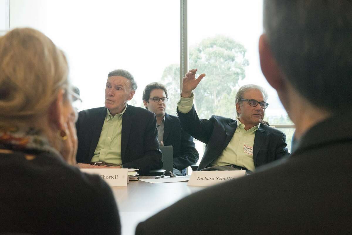 Steve Shortell, left, and Richard Scheffler speak to meeting attendees at the UC Berkeley School of Public Health in Berkeley, Calif. on Friday, Feb. 8, 2019. UC Berkeley Petris health policy experts are releasing a proposal on how to reach universal health care coverage in California.