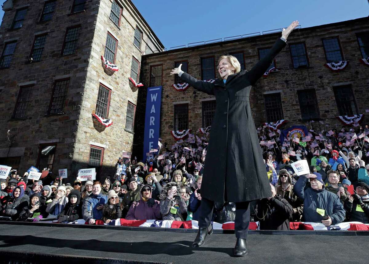 Sen. Elizabeth Warren, D-Mass., acknowledges cheers as she takes the stage during an event to formally launch her presidential campaign, Saturday, Feb. 9, 2019, in Lawrence, Mass.