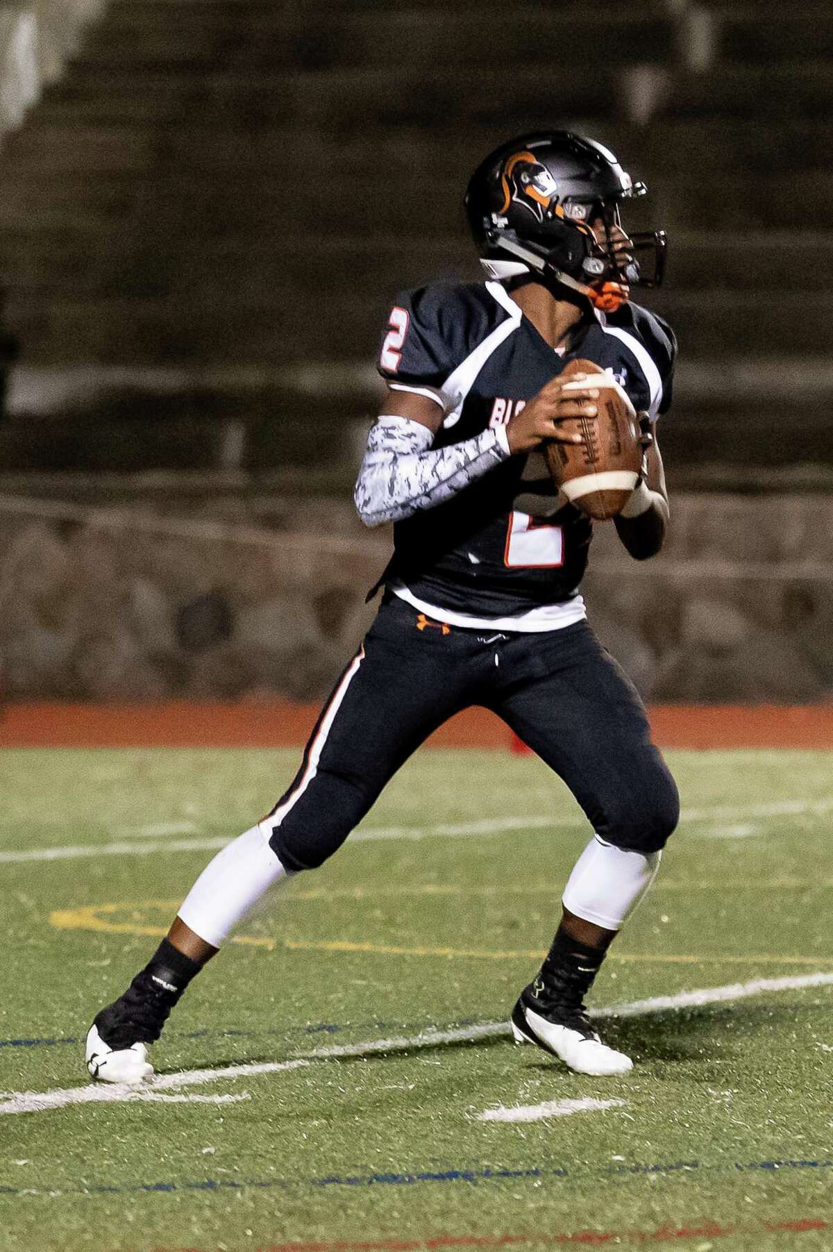 Stamford quarterback Terry Forrester looks to make a pass against Westhill on Nov. 21. Later that night, Forrester was rushed to the hospital after a cardiac event. He is now recovering well from open-heart surgery.