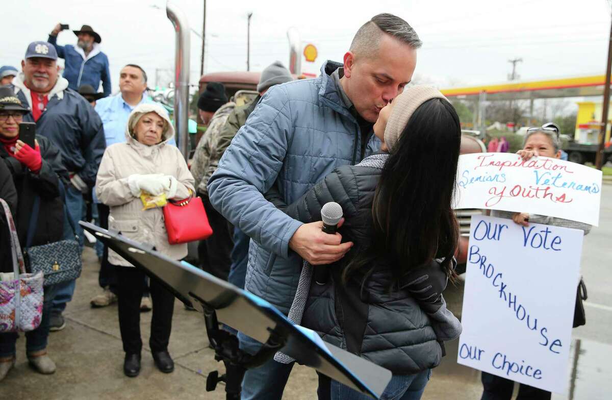 District 6 Councilman Greg Brockhouse kisses his wife, Annalisa, as he announces his bid for city mayor in front of family, friends and supporters just outside Del Bravo Record Shop along Old Highway 90 on a chilly afternoon on Saturday, Feb. 8, 2019. Brockhouse took direct aim at current mayor Ron Nirenberg for his lack of vision for the city. Brockhouse cited several points he would improve: job creation, wage inequality, economic development, lower property taxes, transparency in government and improve public safety relations. Brockhouse's father, the Rev. David Brockhouse started the event off with an invocation and then Brockhouse's wife, Annalisa, introduced the councilman during the announcement.