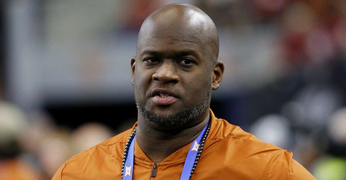 FILE - In this Dec. 1, 2018, file photo, former Texas NCAA college football quarterback Vince Young stands on the sideline during the first half of the NCAA Big 12 Conference championship against Oklahoma, in Arlington, Texas. Texas quarterback Vince Young and Notre Dame speedster Raghib Ismail have been selected, Monday, Jan. 7, 2019, for induction into the College Football Hall of Fame, along with 11 other players and two coaches. (AP Photo/Roger Steinman, File)