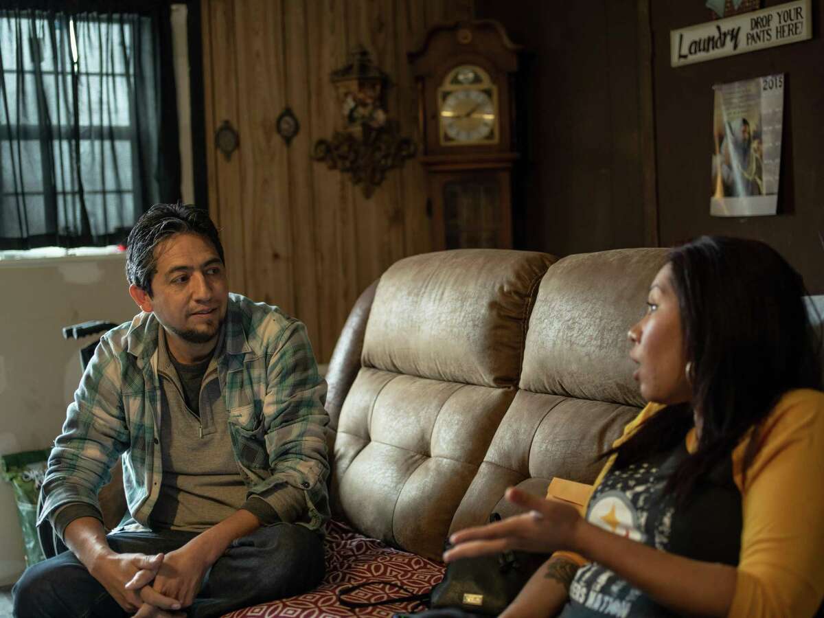 Christina Gutierrez, 34, right, talks with her rescuer, Francisco Martinez, at her in-laws’ home on Jan. 31, 2019. She didn’t know his name when he saved her from two dogs who attacked her as she was walking down a South Side street to work on Jan. 4. She said there were people nearby but no one came to her aid until Martinez, who was driving by on his way to work, stopped his truck to chase off the dogs and cover the badly bleeding woman. He called 911 and stayed with her until EMTs arrived. Doctors said she could have died if Martinez had not intervened. Gutierrez is expected to spend 6 months recovering and will then have to undergo physical therapy.