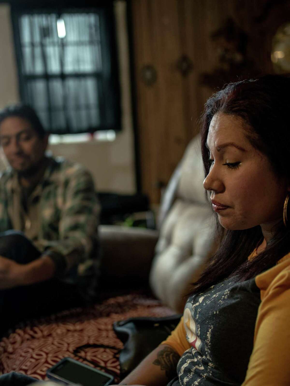 Christina Gutierrez, 34, right, pauses a moment during her recounting of the brutal dog attack she suffered on Jan. 4 while she was walking to walk along a South Side street. She suffered serious leg injuries and was bleeding badly when a passerby stopped to help her, chasing off the dogs and staying with her until the ambulance arrived. Gutierrez is expected to spend 6 months recovering and will then have to undergo physical therapy.