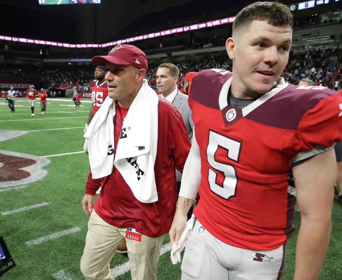San Antonio head coach MIke Riley walks to midfield with his quarterback Logan Woodside after the victory as the Commanders host San Diego at the Alamodome in the opening game for the Alliance of American Football league on February 9, 2019.