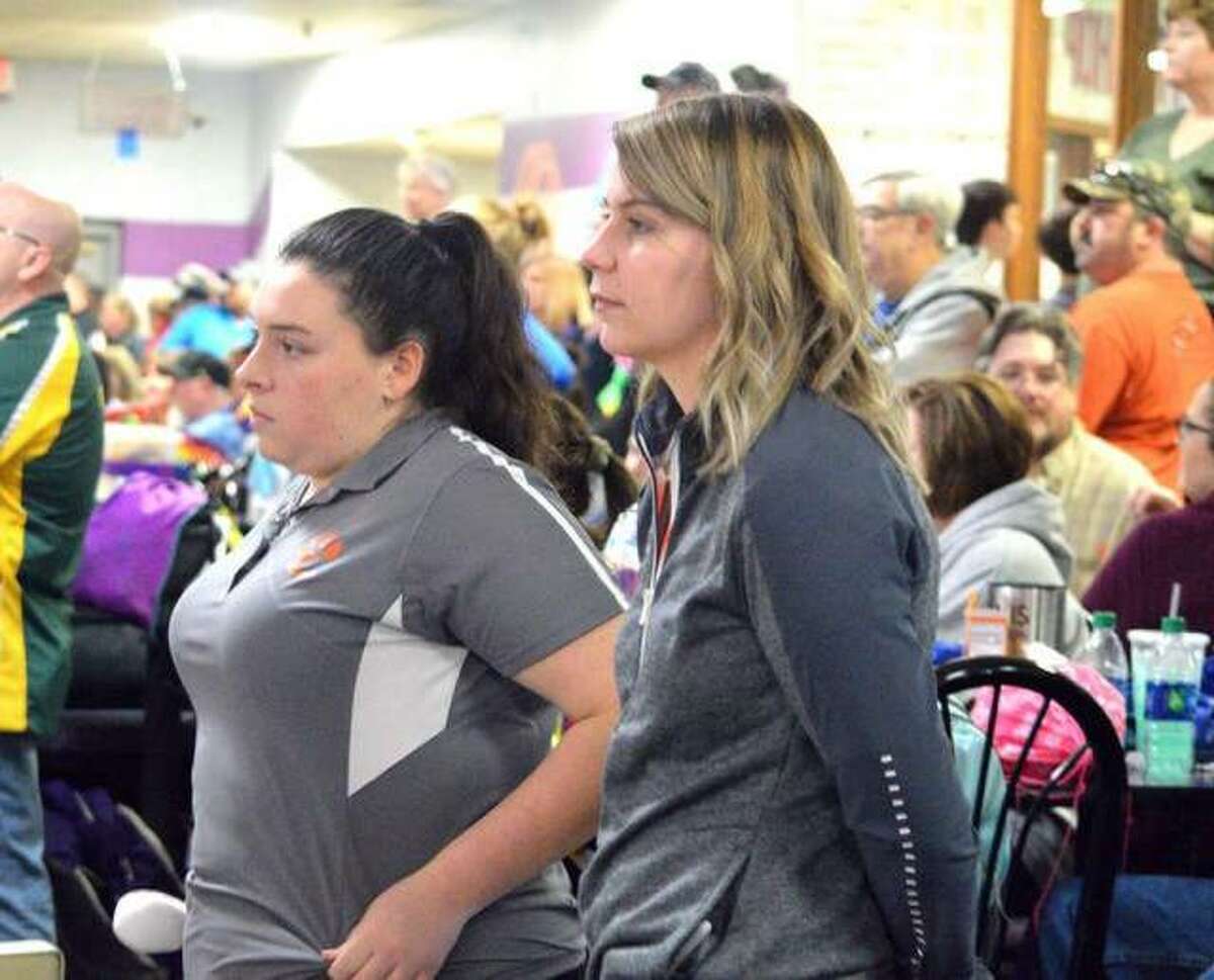 Edwardsville senior Sydney Sahuri, left, and EHS coach Kimber Moscardelli watch the action during the Collinsville Regional on Feb. 2 at Camelot Bowl. On Saturday, Sahuri qualified for the state tournament by placing seventh overall at the Carterville Sectional.