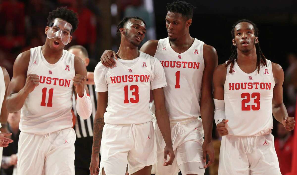 Houston Cougars players Nate Hinton (11), Dejon Jarreau (13), Chris Harris Jr. (2) and Cedrick Alley Jr. (23) are pumped as they are securing the lead against the Cincinnati Bearcats during the second half of the American Athletic Conference game at Fertitta Center on Sunday, Feb. 10, 2019, in Houston. The Houston Cougars defeated the Cincinnati Bearcats 65-58.